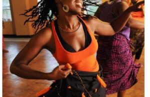 black woman joyful dancing