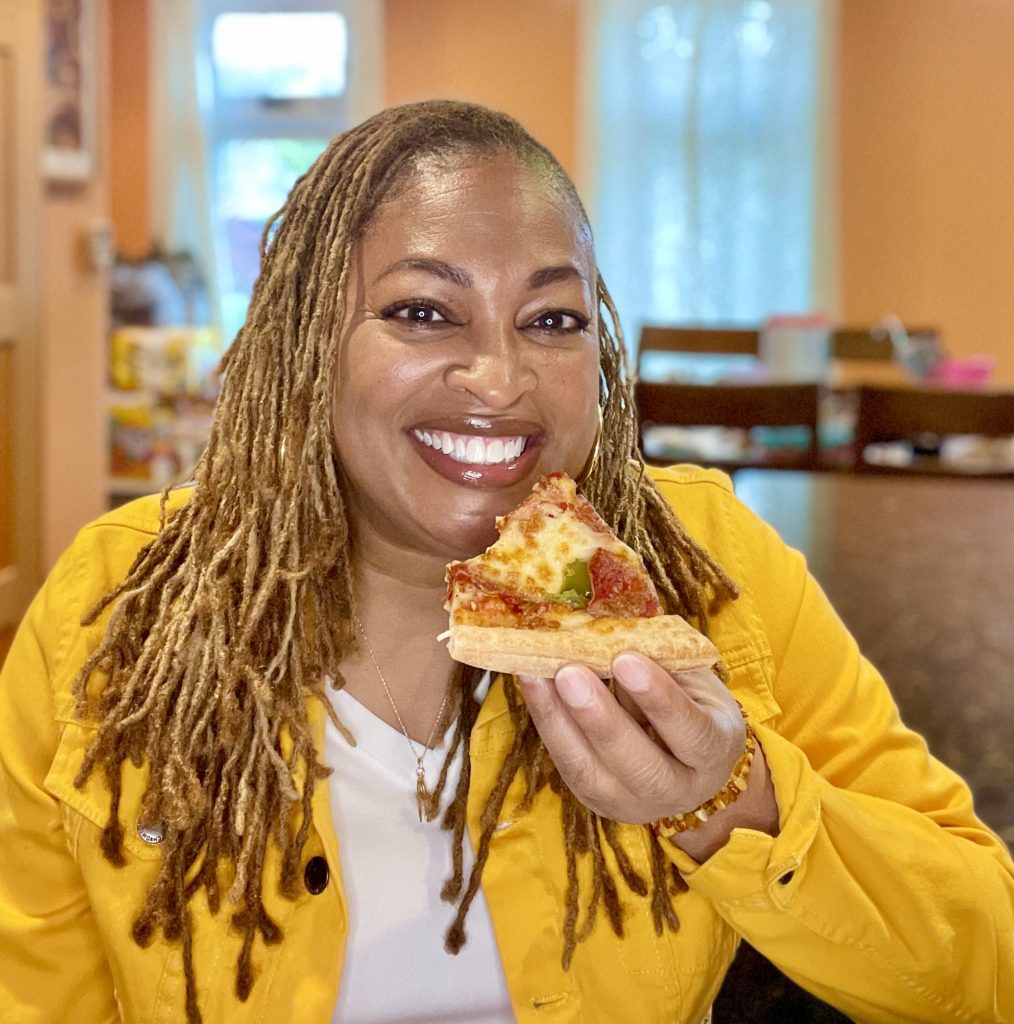 Lisa eating pizza