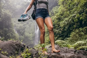 Woman hiking at waterfall